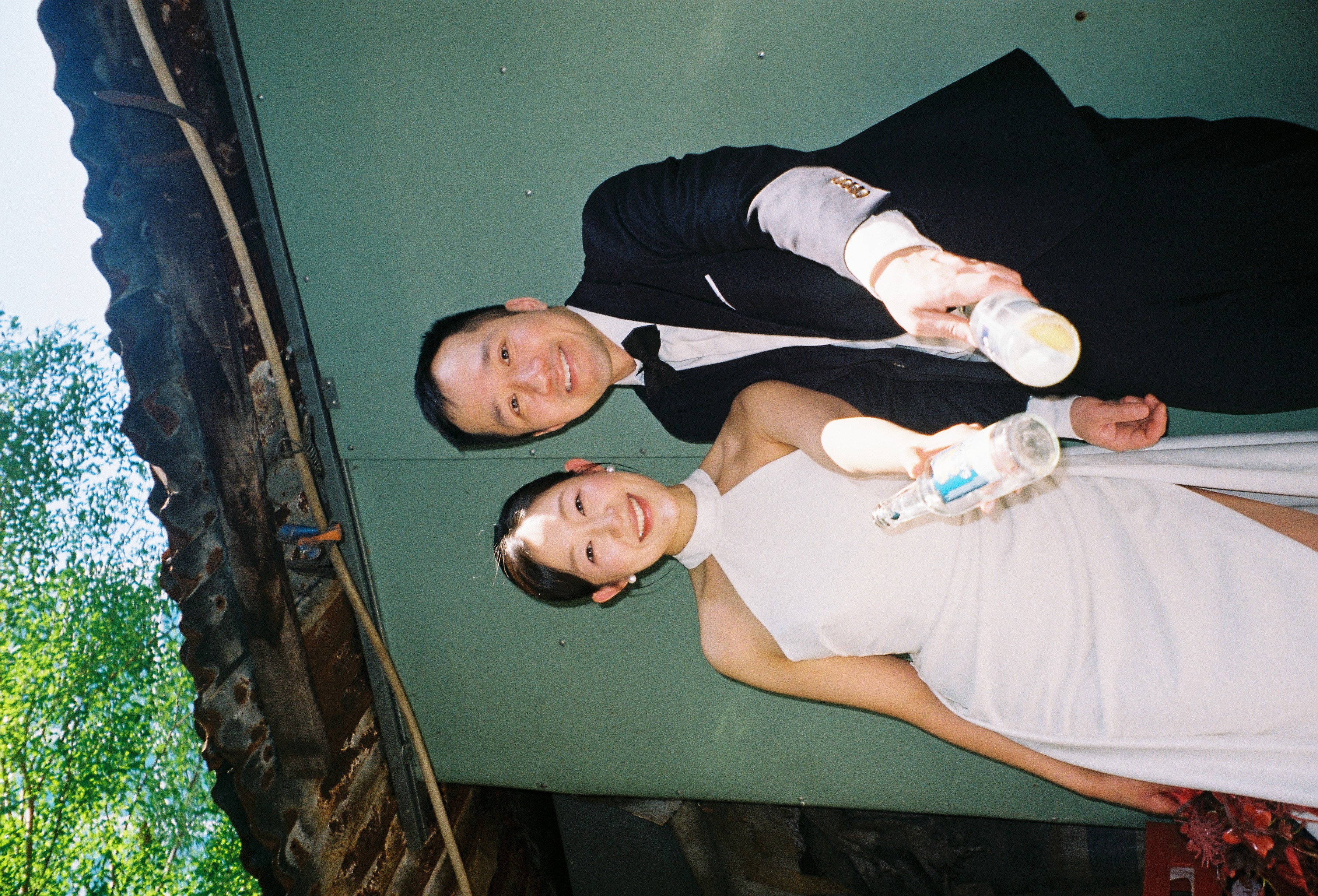 Jessica and Richard against a green wall