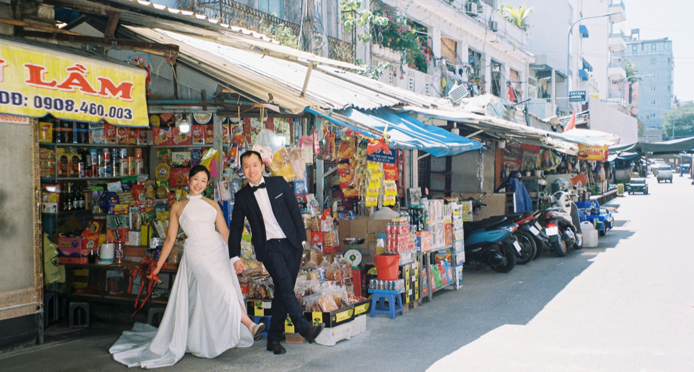 Jessica and Richard walking through a Vietnamese market street